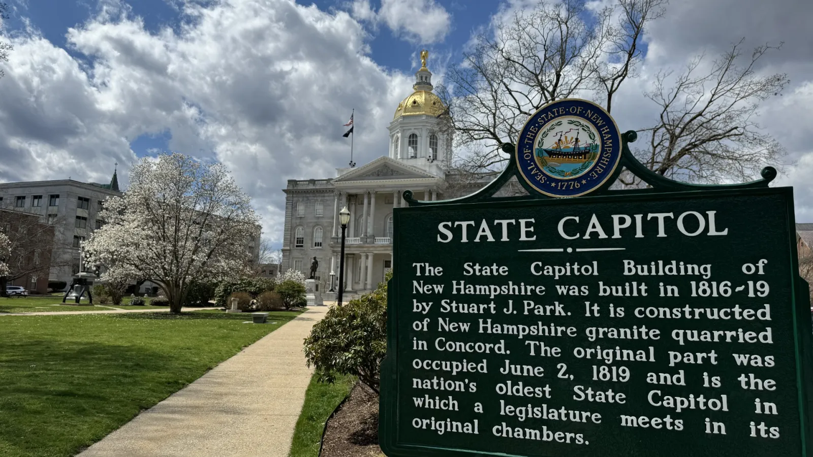 An image of the State Capitol historical placard at the NH State House complex.
