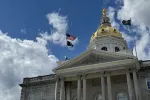 An image of the New Hampshire State House in summer.